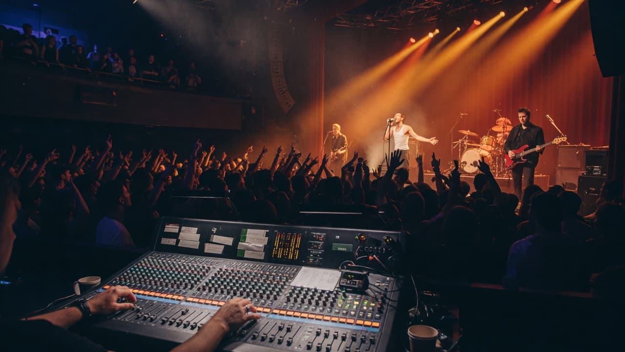 Behind the scenes at a live music venue with warm amber stage lighting